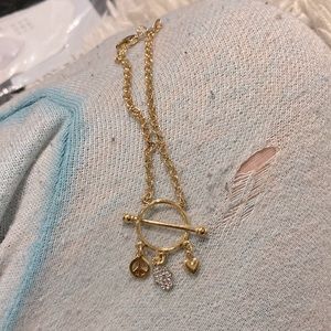 Gold filled bracelet with 3 charms peace symbol hand of god and a heart